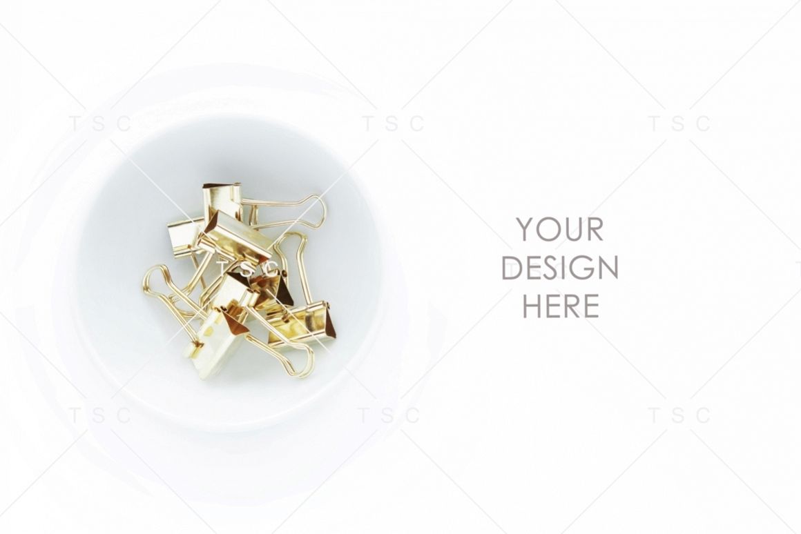 Gold Paper Clips on a White Bowl Stock Photo example image 1
