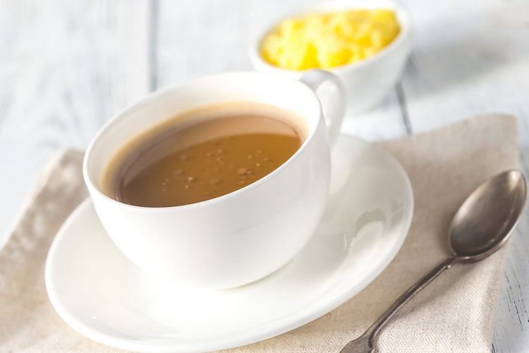 Cup of coffee with ghee butter example image 1
