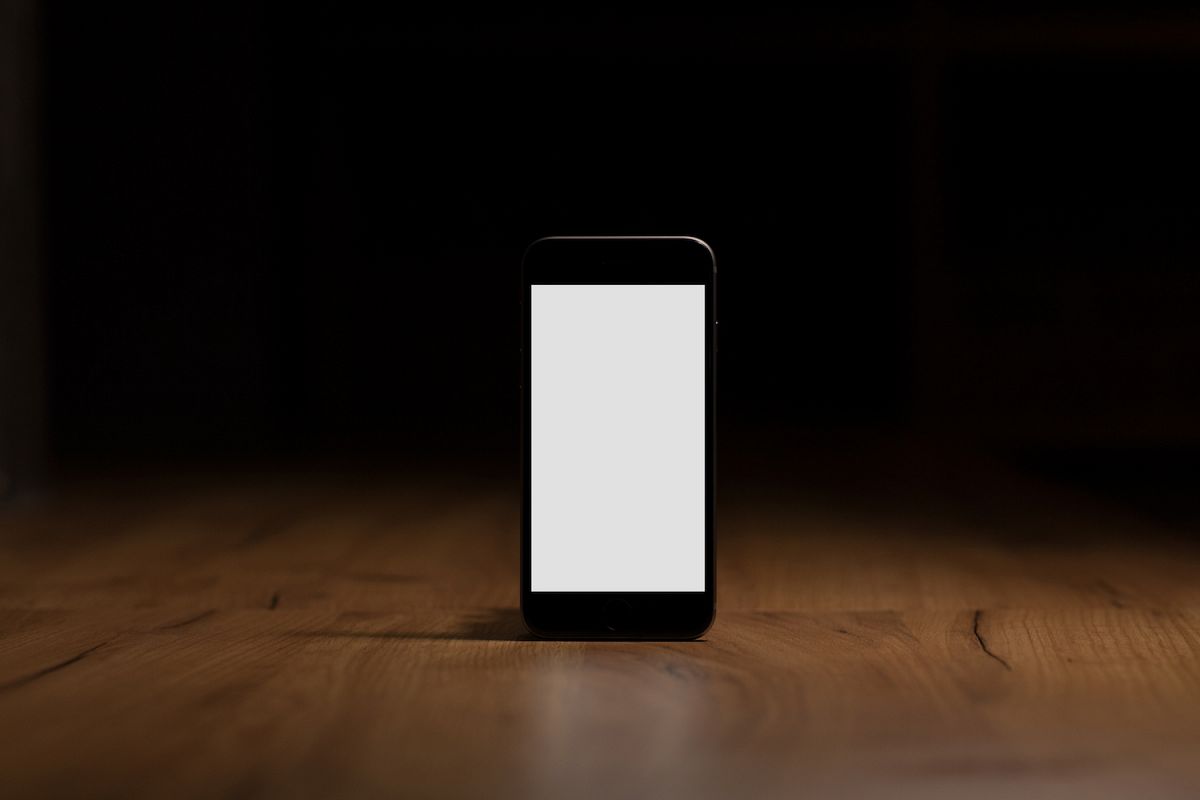 Mobile smart phone with blank screen on the table example image 1