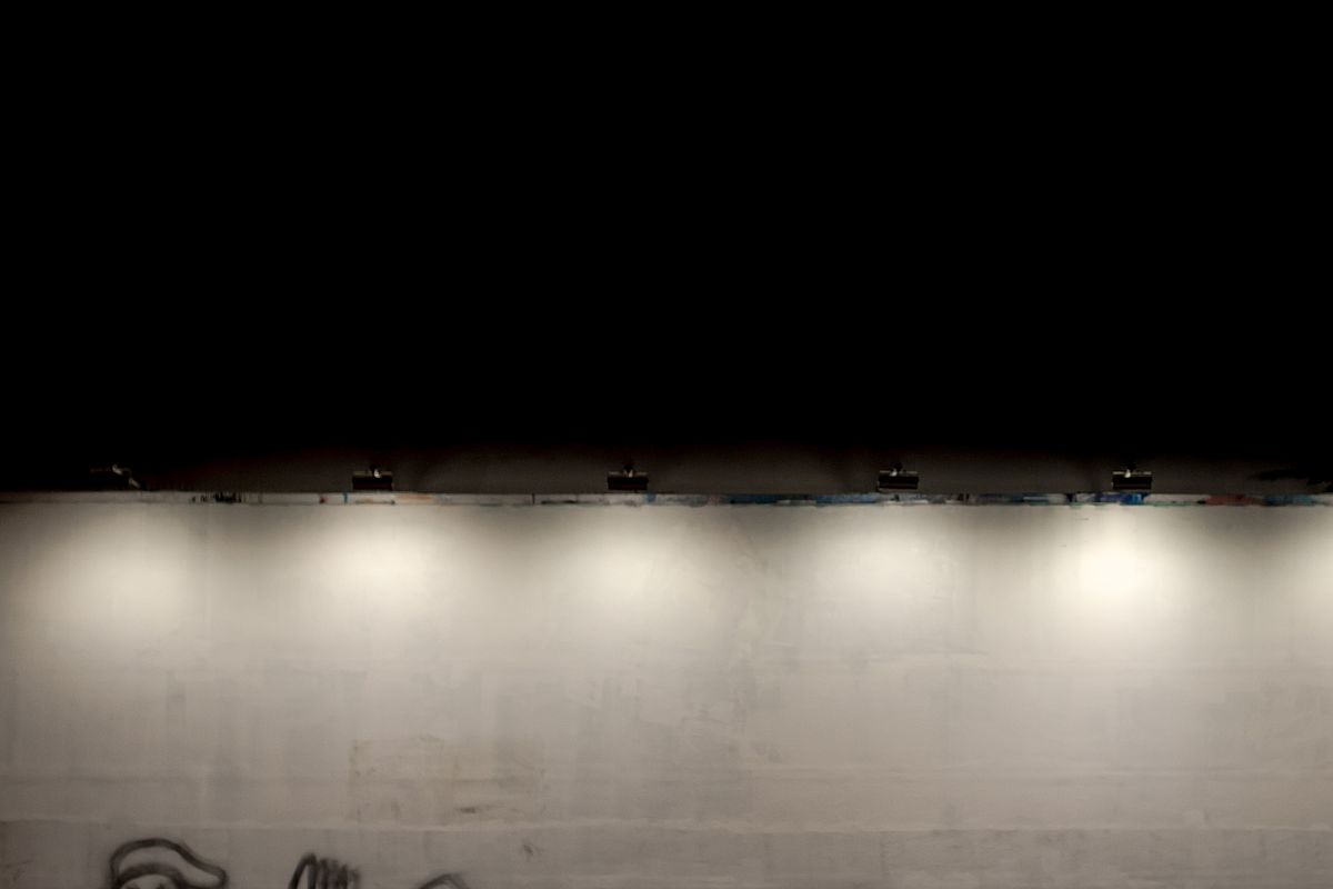 Abstract photography people walking against white wall example image 1