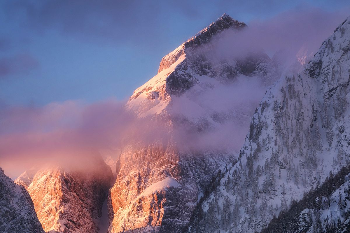 Sunrise in the mountains covered wiht snow example image 1