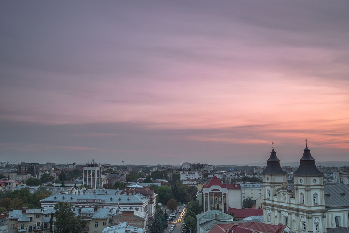 Aerial view of old European city during sunset example image 1