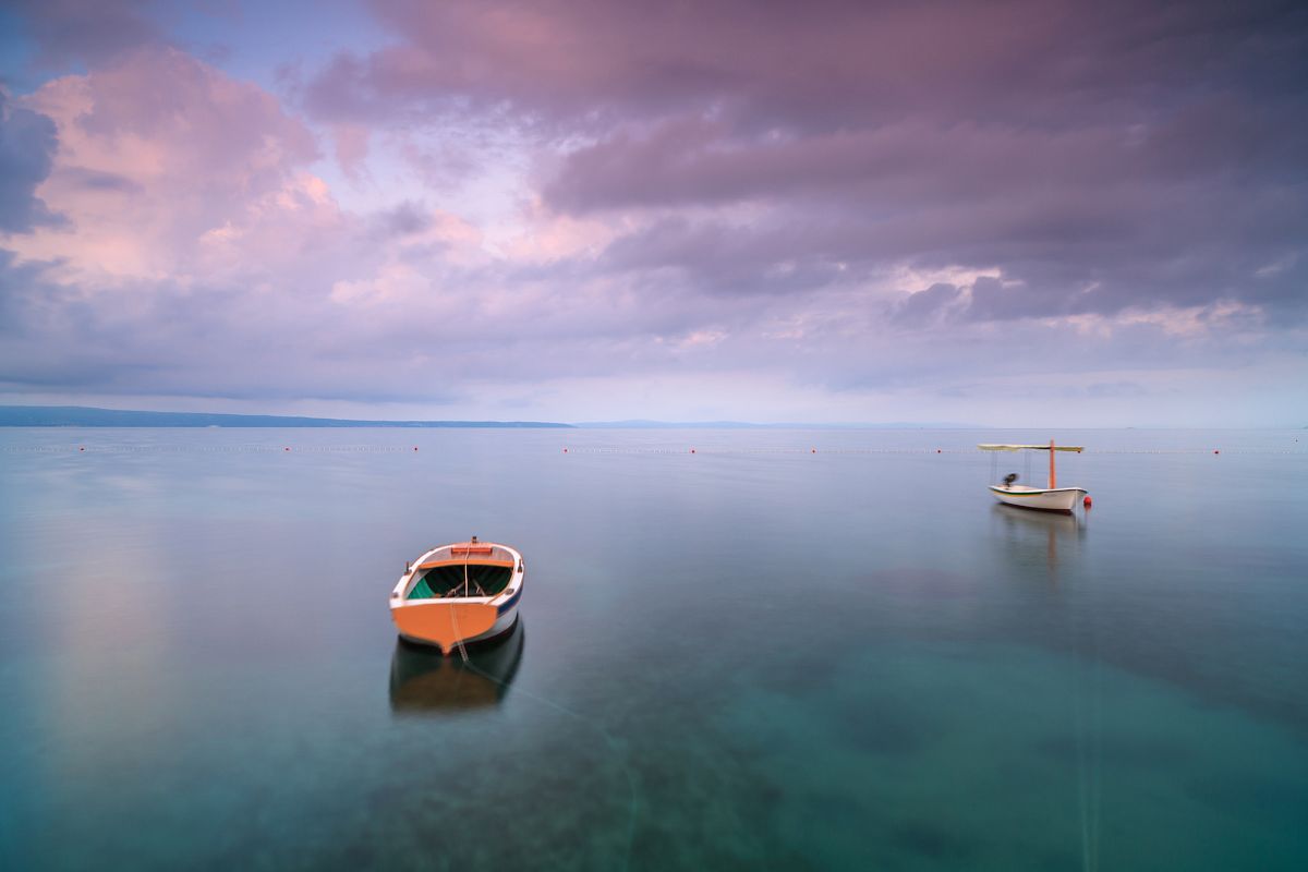 Two boats in adriatic sea at sunrise example image 1