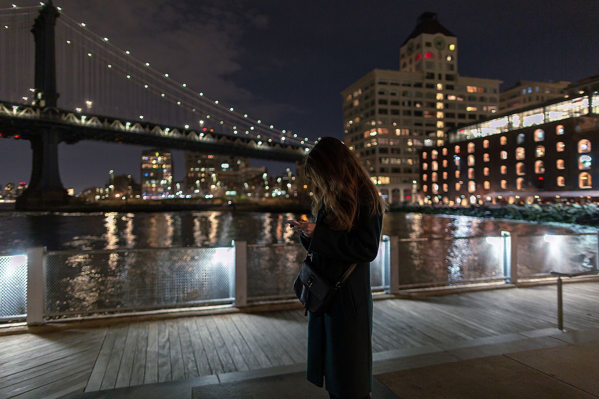 Women on the smartphone in New York at night example image 1