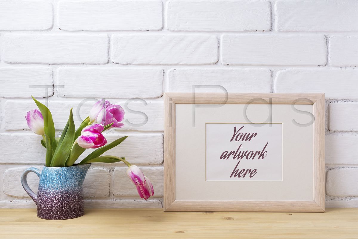 Wooden landscape frame mockup with pink tulip in purple pitcher. example image 1