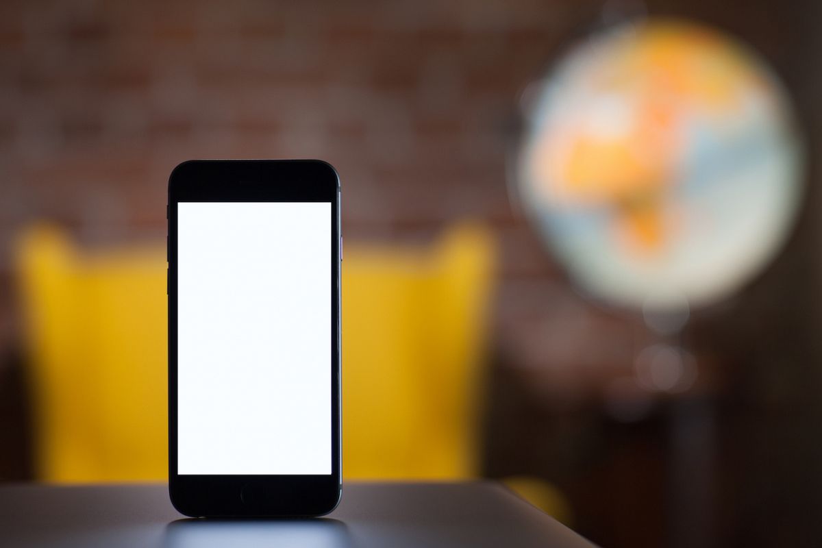 Mobile smart phone with blank screen,blur image on back example image 1
