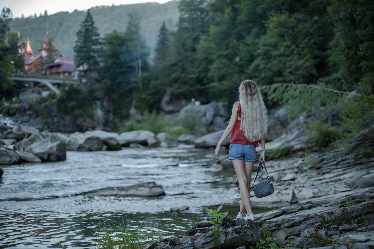 Girl at the river in the Carpathian Mountains example image 1
